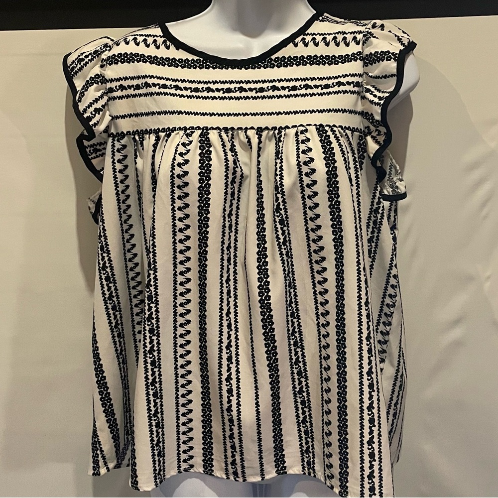 Ruffled Black and White Sleeveless Blouse